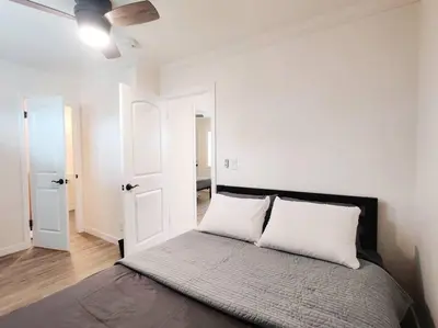 a bedroom with a bed with two white pillows at Cozy 2B1B Guest House with Private Entrance and Parking in El Monte