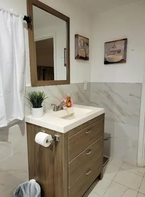 a bathroom with a sink and a mirror at Private guest studio 5 minutes to Rodeo Drive and in great area in Los Angeles