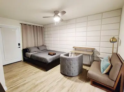 a bedroom with a bed and a couch and a chair at Spacious 3BR Modern Home in LA Perfect for Family in El Monte