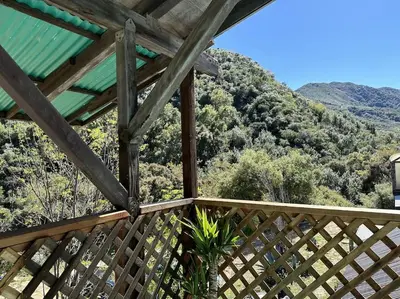 a wooden balcony with a view of a mountain at Topanga Panoramic View Loft with Trails & Creeks in Topanga