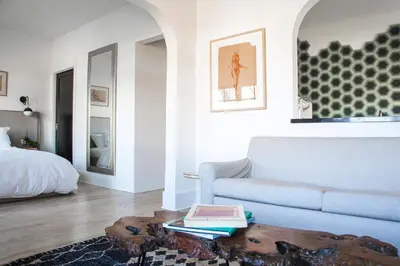 a living room with a couch and a coffee table at Hotel Covell in Los Angeles