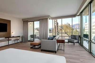 a hotel room with a view of a living room at AC Hotel by Marriott Pasadena in Pasadena
