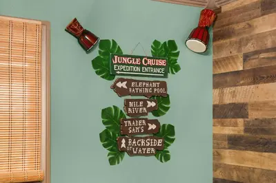 a sign on the wall of a room that reads university course absorption exchange at Disneyland Oasis by OC Adventure Homes in Cypress