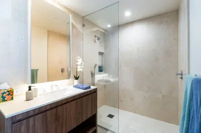 a bathroom with a sink and a shower at The Pearl Coast - Rooftop Pool, Gym Luxurious 2BR Santa Monica in Los Angeles