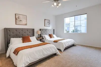 a bedroom with two beds and a window at Well-Located 3BR Near SoFi Stadium & LAX in Los Angeles