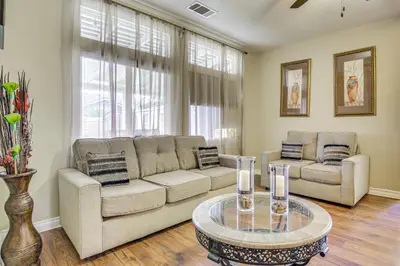 a living room with two couches and a table at Family-Friendly Home with Fenced Yard in Victorville in Victorville