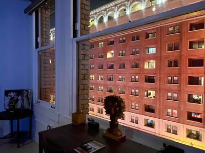 a room with a large window with a building at Iconic Heart of DTLA Loft with Rooftop Pool Jacuzzi Gym in Los Angeles