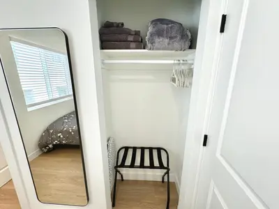 a mirror in a room with a chair and a shelf at RP415B - Inviting 1-Bedroom Haven in Captivating Burbank in Burbank