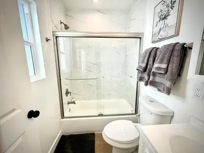 a bathroom with a glass shower and a toilet at RP415B - Inviting 1-Bedroom Haven in Captivating Burbank in Burbank
