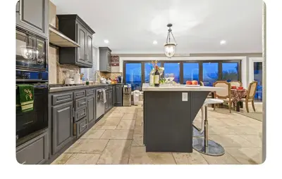 a kitchen with a island in the middle of a room at LA Million dollar VIEW super spacious 5 bedroom home in Hacienda Heights