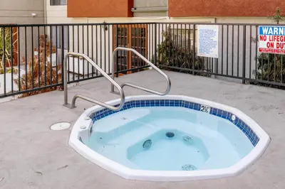 a jacuzzi tub sitting outside of a building at Blueground N Hollywood Gym Pool nr shops LAX-515 in Los Angeles