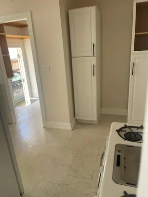 a kitchen with a stove and a white counter top at Hancock weho in Los Angeles