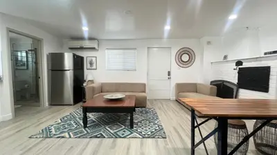 a living room with a couch and a table at Two Bedrooms Back House in Los Angeles in Los Angeles