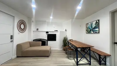 a living room with a table and a chair at Two Bedrooms Back House in Los Angeles in Los Angeles