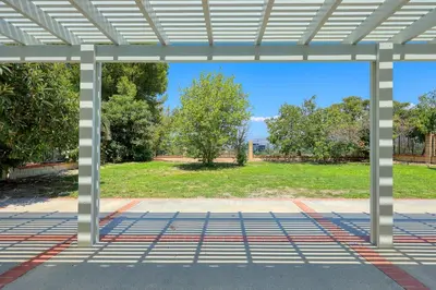 a pergola with a view of a park at Newly Remodel Luxury Home with Hotel-Like Amenity in Rowland