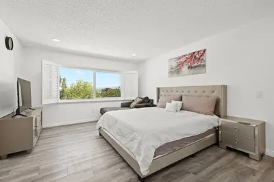 a bedroom with a bed and a television in it at Newly Remodel Luxury Home with Hotel-Like Amenity in Rowland