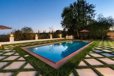 a swimming pool in the middle of a yard at Luxury 4BD and 3BA in Topanga Oasis with Pool, Spa and Cabana in Glenview