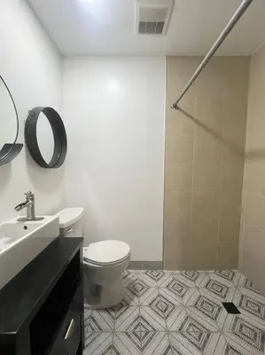 a bathroom with a toilet and a sink and a shower at Great Private Studio in Noho in Los Angeles