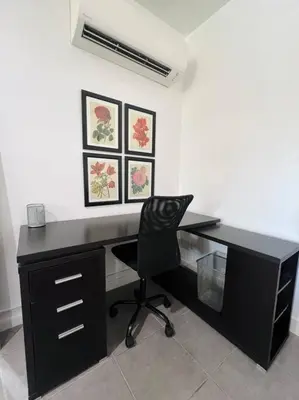 a black desk with a black chair in a room at Great Private Studio in Noho in Los Angeles