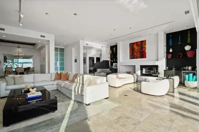 a living room with white furniture and a fireplace at Crest Estate by Stay Awhile Villas in Los Angeles