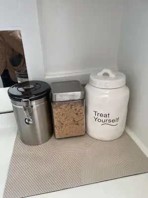 a refrigerator with two containers of food in it at Chambre de Bonne in Downtown Long Beach in Long Beach