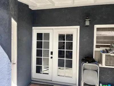 a room with a white door and a window at Cozy Room In Downey in Downey