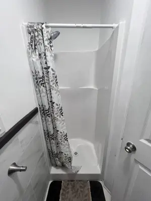 a bathroom with a shower curtain and a sink at Cozy Room In Downey in Downey
