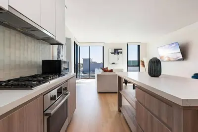 a kitchen with a stove and a counter top at The Rose Quartz - Rooftop Pool, Gym Glamorous Santa Monica 2BR in Los Angeles