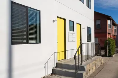 a building with yellow doors and stairs on a street at Sunny 1 Bedroom in the Heart of Venice Beach - #3 in Los Angeles