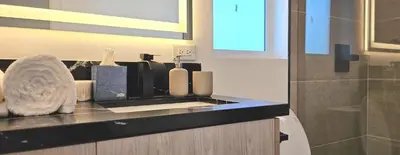 a bathroom with a counter top with at Southwest Stay in Los Angeles