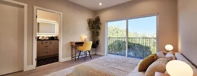 a bedroom with a bed and a large window at Southwest Stay in Los Angeles