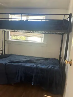 a bedroom with a bunk bed and a window at Santa Monica Stays in Los Angeles
