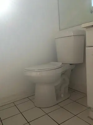 a bathroom with a white toilet in a room at Santa Monica Stays in Los Angeles