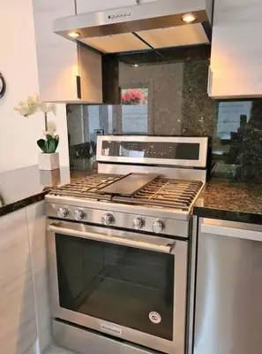a kitchen with a stainless steel stove top oven at Prime LA 2 bedroom & 3 bath home Beverly Hills adj in Los Angeles