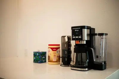 a coffee maker sitting on top of a counter at Cozy Retreat Near Downtown - Perfect for Families in Long Beach
