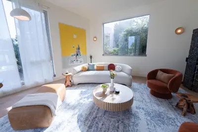 a living room with a couch and a table at Unique Home with Stunning Views in the Heart of Los Angeles, CA, Silverlake! in Los Angeles