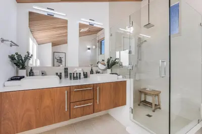 a bathroom with two sinks and a shower at Cedar Loft Villa in Los Angeles