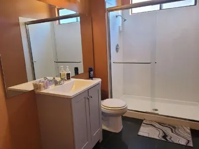 a bathroom with a sink and a toilet and a shower at 3BR & Loft near Palmdale Hospital- Shared Hm in Palmdale