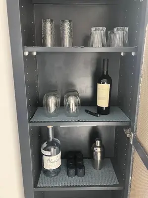 a refrigerator with two bottles of wine and glasses at Luxe Suite Convention Center Partial Ocean View with Free Parking in Long Beach