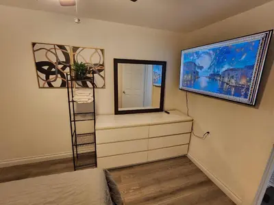 a bedroom with a dresser and a mirror at RGS cottage in Los Angeles in Los Angeles