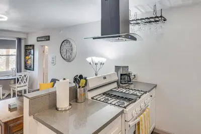 a kitchen with a stove and a counter top at The Surf Retreat in Newbury Park