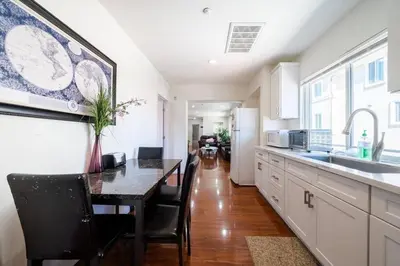 a kitchen with a dining table and a dining room at 22ppl Garage Parking Btw Disney Hollywood Monterey Park Chinatown in Monterey Park