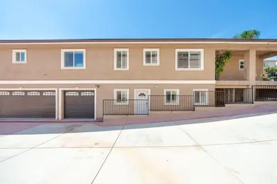 a large apartment building with two garages at 22ppl Garage Parking Btw Disney Hollywood Monterey Park Chinatown in Monterey Park