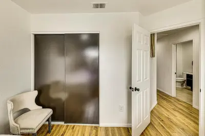 a sliding glass door in a room with a chair at 2 Mi to Victoria Gardens Rancho Cucamonga Haven in Rancho Cucamonga