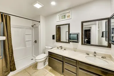 a bathroom with two sinks and a toilet and a shower at 2 Mi to Victoria Gardens Rancho Cucamonga Haven in Rancho Cucamonga