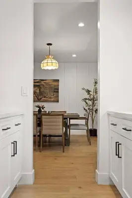 a kitchen and dining room with a dining table at 1970s Style Cozy Home with Fireplace Yard and Hot Tub in Inglewood
