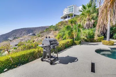 a barbecue grill parked in front of a house at 3 Mi to Beach Home with Pool and Spa in Malibu! in Malibu