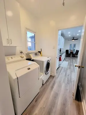 a laundry room with a washer and dryer in it at 3 bedroom top story apartment near Pico blvd in Los Angeles
