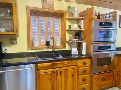 a kitchen with a sink and a counter top at Cabin 7 sleeps 8 BEAUTIFUL BOULDER BAY, BIG BEAR in Big Bear Lake