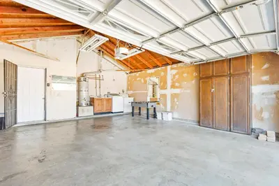 an empty room with a kitchen in a building at Gated 6beds 2garage home near Disney other LA attraction in Chino
